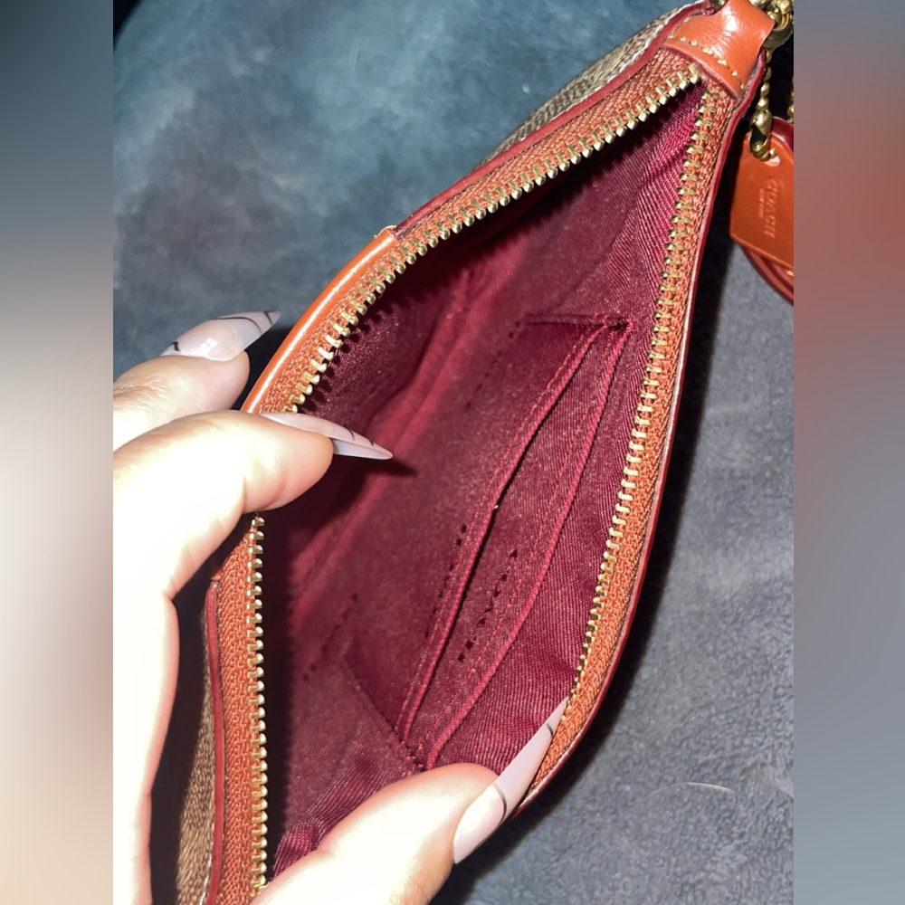 Signature Coach Wristlet in the Rust colorway 🫶🏽 - Picture 2 of 4